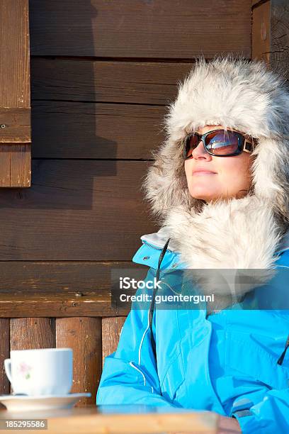 Woman Enjoying The Sun After Skiing Stock Photo - Download Image Now - Luxury, Skiing, 30-34 Years