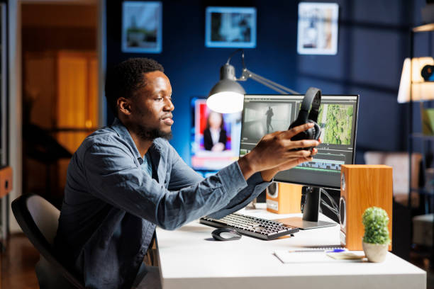 istock Filmmaker editing video footage at home desk 1852962558