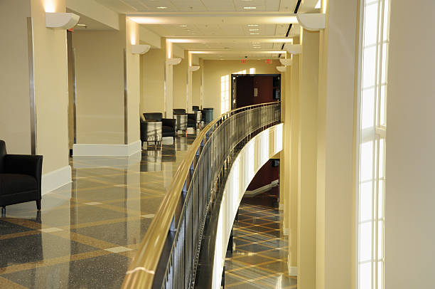 istock Curved two story hallway in modern building 185296340