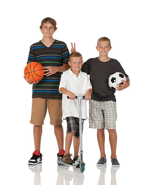 istock Children standing with sports equipment 185296893