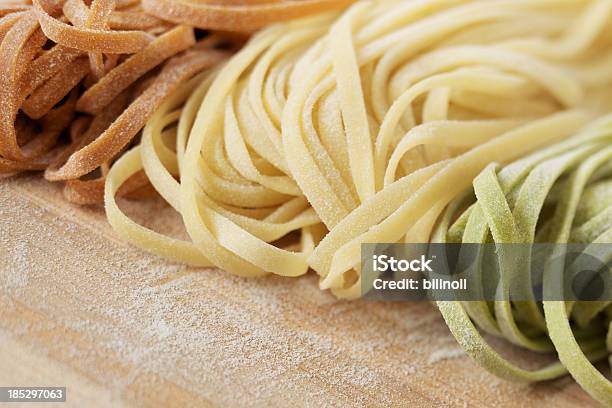 Fresh Uncooked Linguine Pasta On Wood Stock Photo - Download Image Now - Freshness, Pasta, Antioxidant