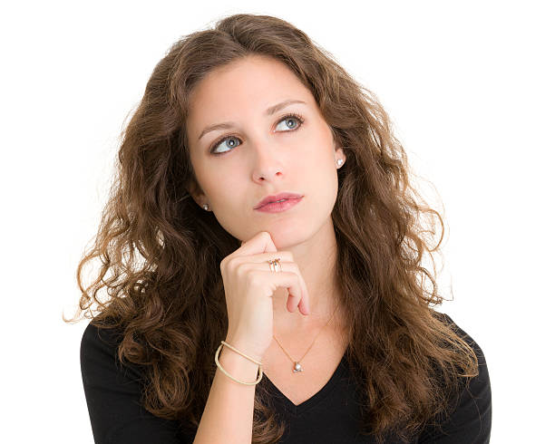istock Daydreaming Young Woman Looks Up 185297168