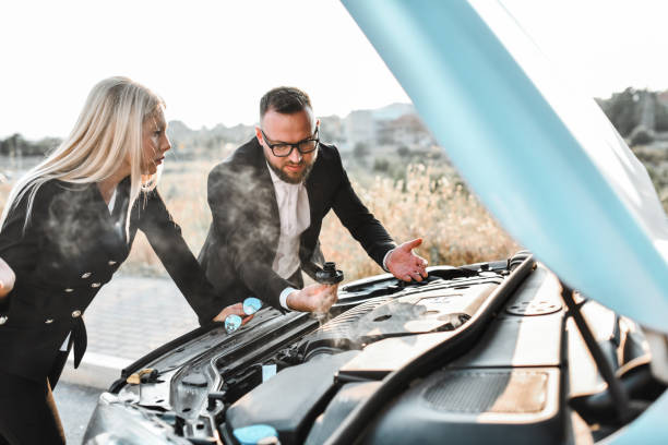 istock Car Engine Steaming After Breakdown For Business Couple 1852971985