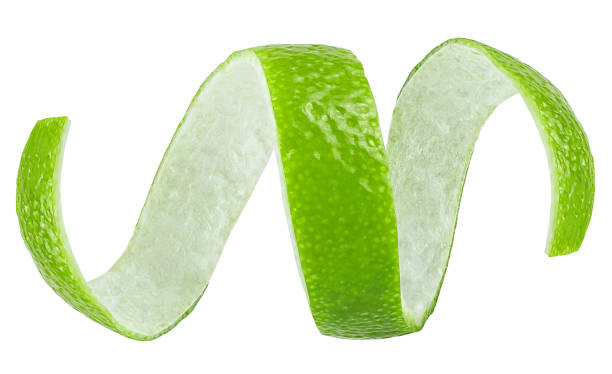 istock Curly lime peel twist isolated on a white background. Green lime zest. 1852973643