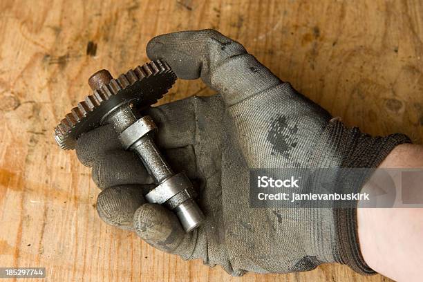 Mechanic Holds Timing Gear Shaft Stock Photo - Download Image Now - Adjusting, Adult, Adults Only