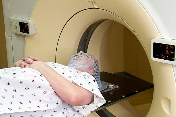 istock Man Receiving Medical Scan for Brain Tumor 185298393