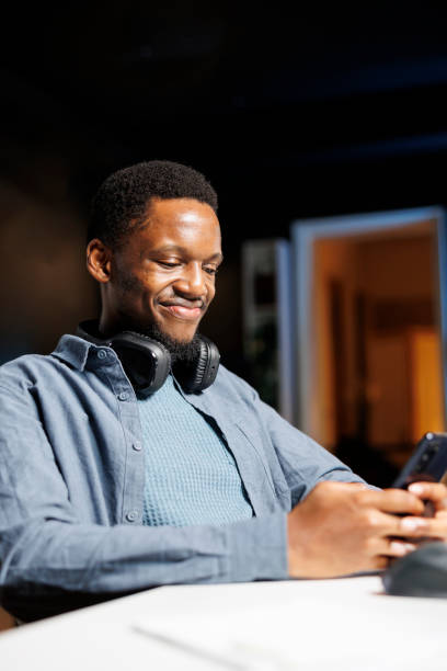 istock Male developer checking social media app on phone 1852984275