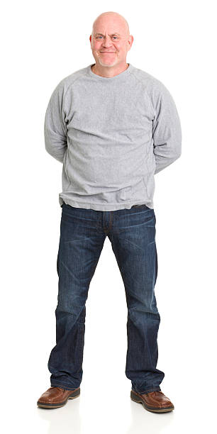 Content Man Standing Full Length Portrait Portrait of a mature man on a white background. http://s3.amazonaws.com/drbimages/m/cc2.jpg hands behind back stock pictures, royalty-free photos & images