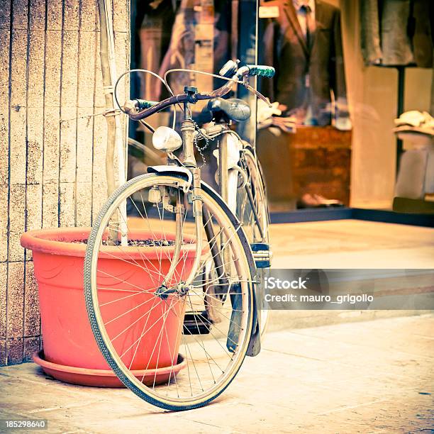 Bicycle Leaning Against Wall On Italian Street Stock Photo - Download Image Now - 1950-1959, 1960-1969, 1970-1979