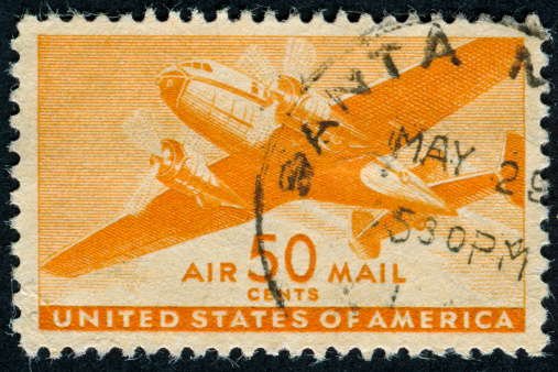 Cancelled Stamp From The United States Featuring An Airplane And Air Mail