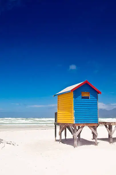 "Muizenberg colorful beach huts in Cape Town, South africa."