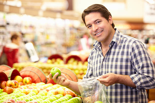 istock Man buying fruit in supermarket 185299350