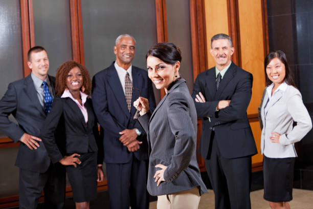 istock Businesswoman in boardroom with colleagues 185299530