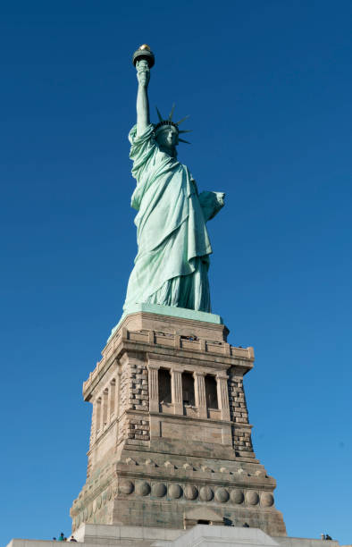 istock Statue of Liberty, with a blue sky background 1852995360