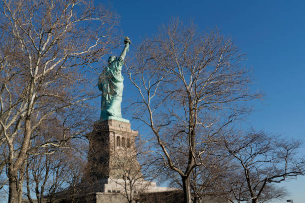 istock Statue of Liberty, with a blue sky background 1852995361