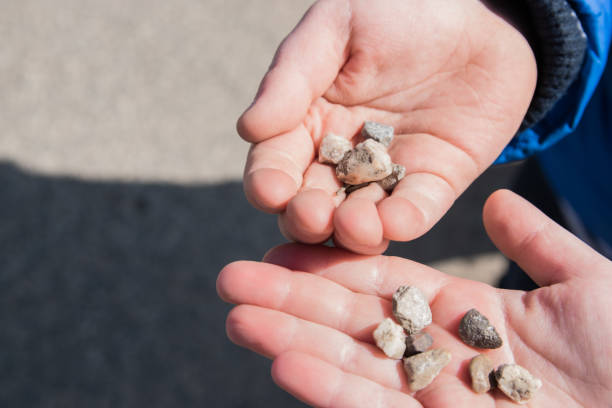 istock Stones in hands of the children. 1852999607