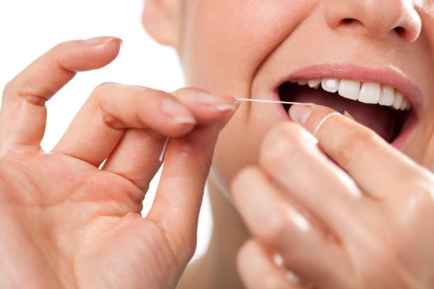 istock Close up of a woman flossing 185300450