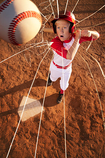 giocatore di baseball colpire la palla attraverso una finestra - baseballs baseball breaking broken foto e immagini stock