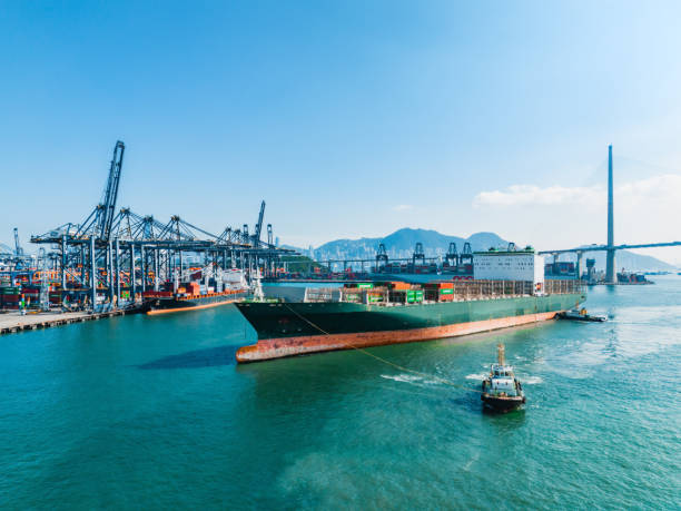 istock Container ship in import export and business logistic in Hong Kong 1853009494