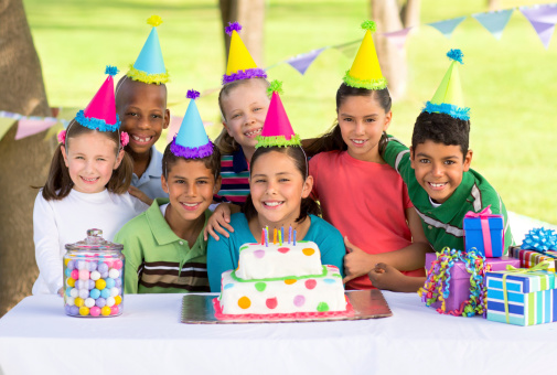 Multi-ethnic children celebrating a birthday