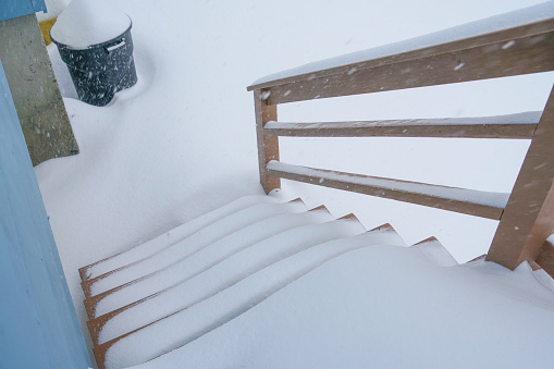 high angle view of exterior wooden staircase after snow