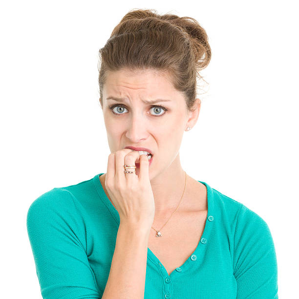 istock Nervous Young Woman Biting Nails 185301071