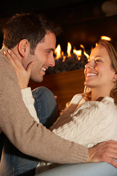 istock Romantic portrait couple in front of fire 185301270