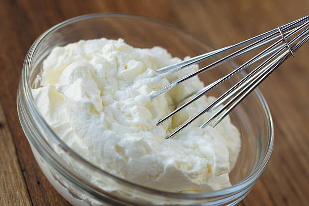 istock Whipped cream and whisk in glass bowl 185301347