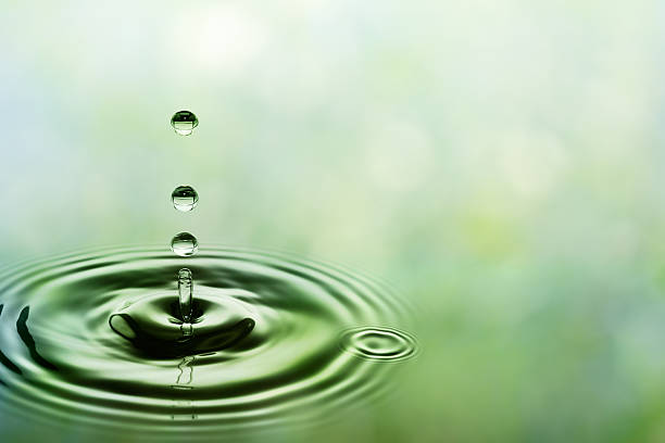 istock Green falling drops of water 185301950