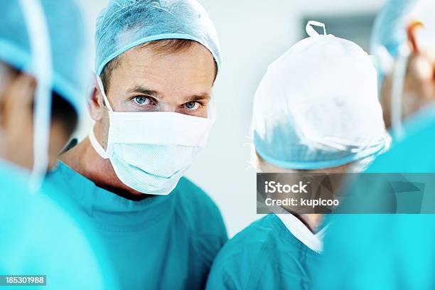Every Moment Counts When A Life Is At Stake Stock Photo - Download Image Now - Surgeon, Portrait, Protective Face Mask