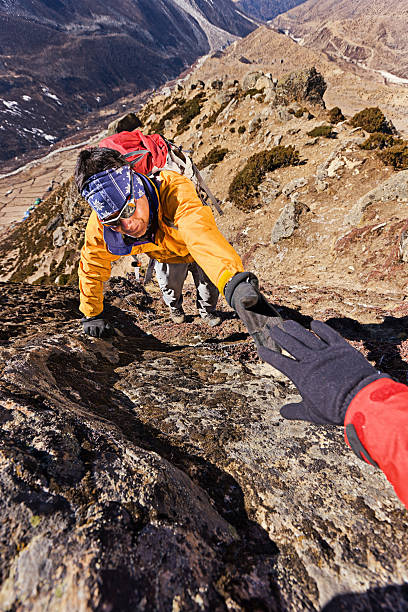 istock Nepali sherpa climbing in Himalayas 185302153