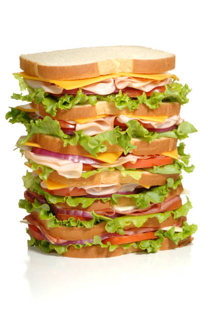istock Piled High Roast Beef Turkey Ham Sandwhich on White 185302223
