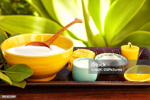 Spa Still Life With Moisturizer Scrub Exfoliation Sponge And Candle Stock Photo - Download Image Now