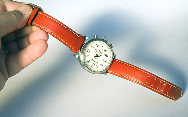 istock Holding a wristwatch 185302658