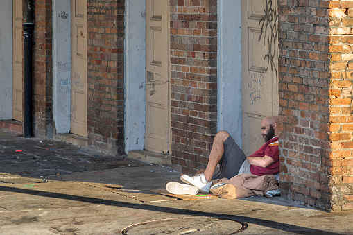 New Orleans, USA - October 25, 2023: homeless people sleep over night at the walkway in the BOURBON STREET IN New Orleans, USA.