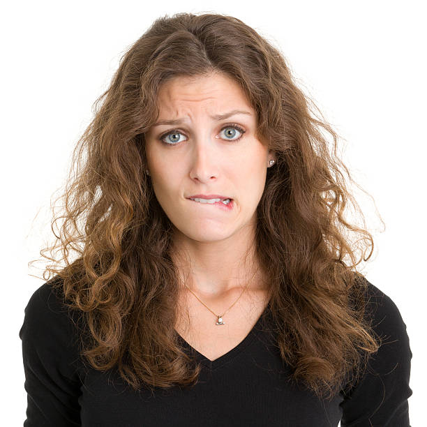 istock Young Woman Biting Lip 185303238