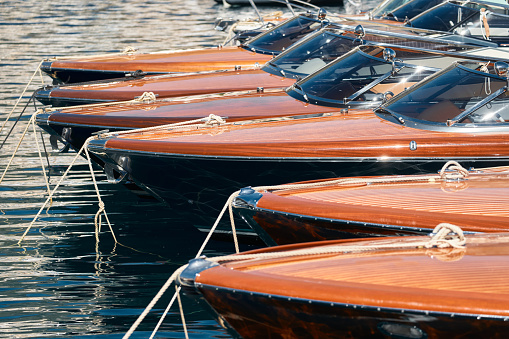 Few luxury retro motor boats in row at the famous motorboat exhibition in the principality of Monaco, Monte Carlo, the most expensive boats for the richest people, boats for rich clients