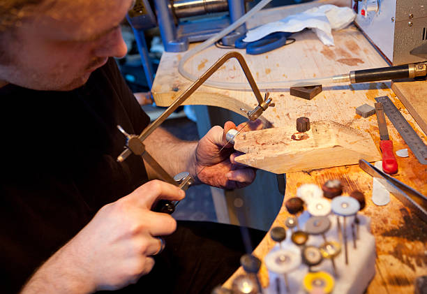 istock Jeweller working in workshop 185303276