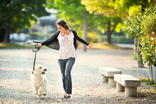istock Young woman with her dog 185303316