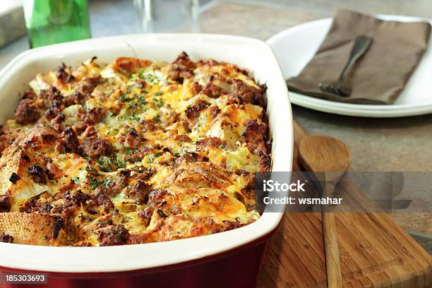 Savory Breakfast Casserole Next To Wooden Spoon Stock Photo - Download Image Now - Casserole, Breakfast, Sausage