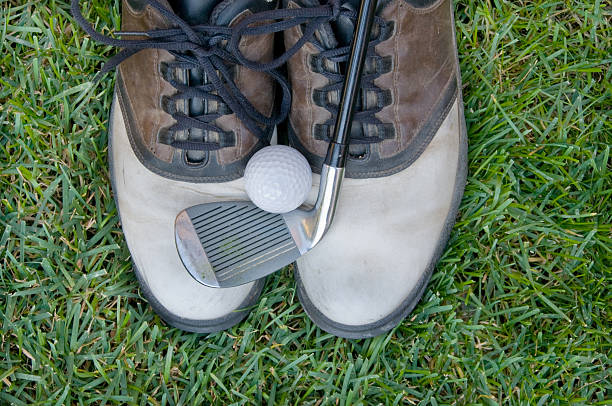 istock Man's golf shoes, club and ball 185303828