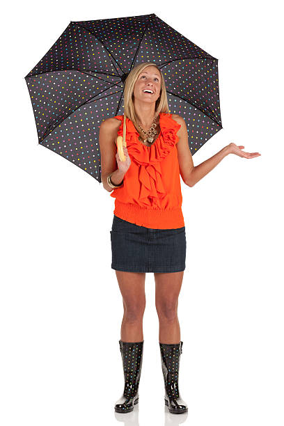 Beautiful woman sheltering under an umbrella