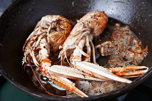 istock Langoustines frying in garlic butter 185304094