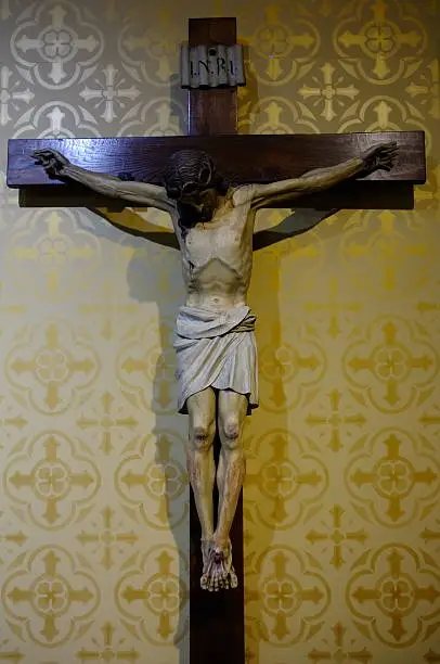 Wide angle image of life size religious icon on a cross.