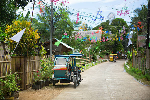 Philippino village with Christmas decorations Philippino village with traditional Christmas decorations philippines tricycle stock pictures, royalty-free photos & images