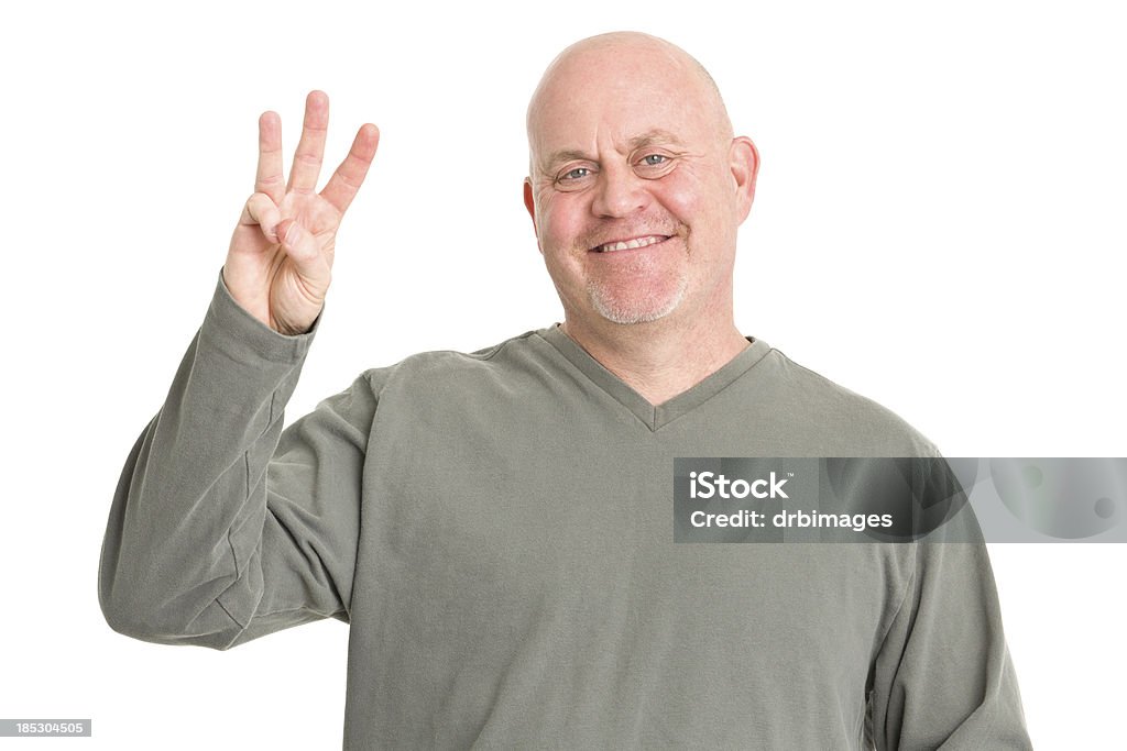 Homem sorridente mostra de Três Dedos - Foto de stock de Homens royalty-free