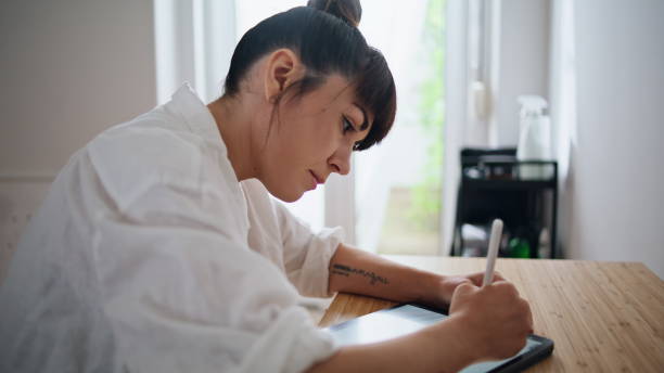 istock Inspired woman drawing tablet at home office closeup. Designer using graphic pad 1853046076