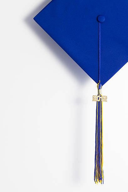 Blue graduation cap with gold tassel isolated on a white background