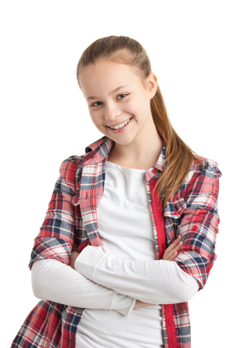 Portrait of a happy smiling girl in a red T-shirt making a sign with her hands, isolated on a white background