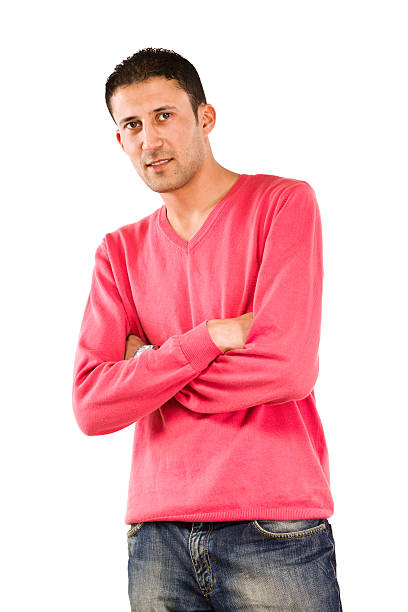 A selection of cozy knit sweaters arranged neatly on hangers, featuring warm, neutral tones. Perfect for fashion and textile concepts. Demonstrating color of 2025 year.